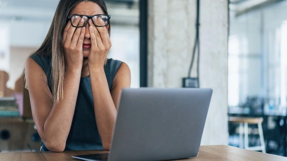 How Long Does Perimenopause Last? a woman looks up the answer on her laptop